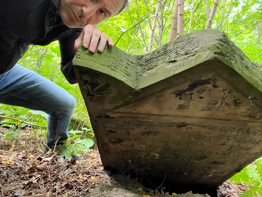 Reading a headstone in Warsaw, Poland